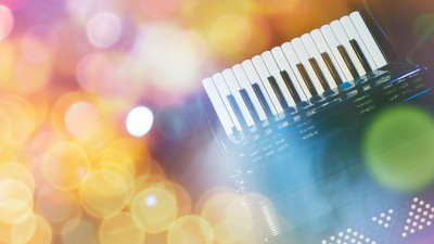 Akkordeon mit bunten Lichtpunkten