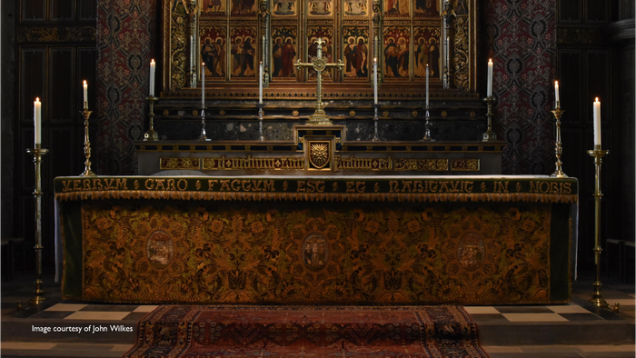 Church altar with ornate decorations and candles.