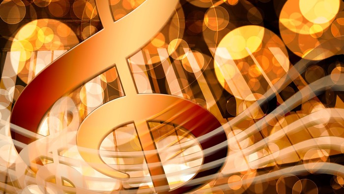 Abstrakte musikalische Noten mit leuchtendem, bokehbeleuchtetem Hintergrund und warmen goldenen Tönen.