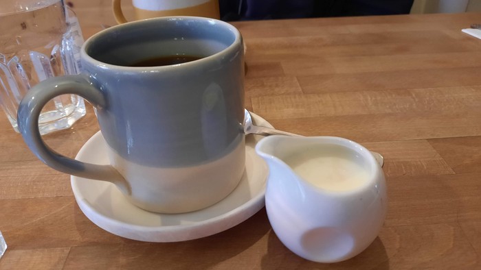 Cup of tea and milk jug