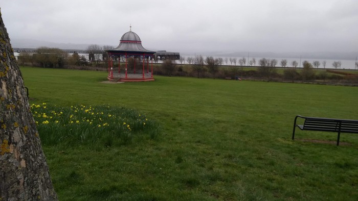 Magdalen Green bandstand with daffodils in the foreground
