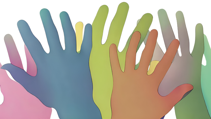 Fem hender i forskellige farver udstrakt motiverende til samarbejde