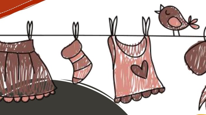 Kleidung, die an einer Leine trocknet, mit einem Vogel und herzförmigen Motiven.
