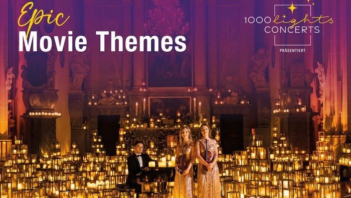 Ein Paar tanzt auf der Bühne, umgeben von Kerzen, während die Texte *„Epic Movie Themes“* und *„1000 Lights Concerts“* eingeblendet werden.