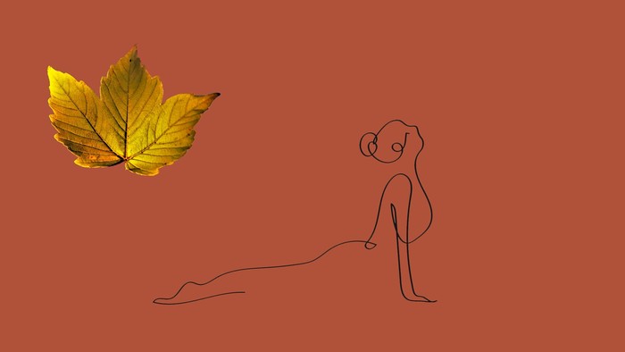 En simpel stregtegning af en person, der sidder med et gult efterårsblad ved siden af sig.