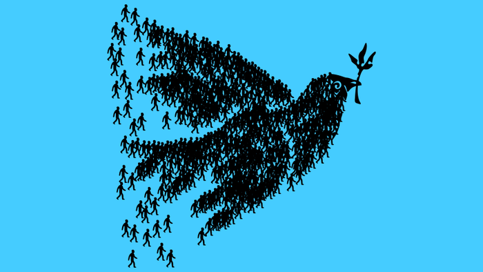 Menschen bilden den Umriss einer Taube