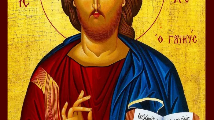 Das Bild zeigt eine Ikone von Jesus Christus mit Buch und griechischem Text.