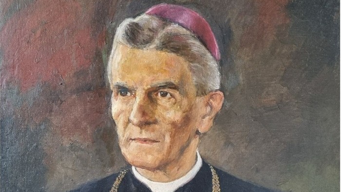 Ein Porträt eines Geistlichen in kirchlicher Kleidung mit Birett und Kette