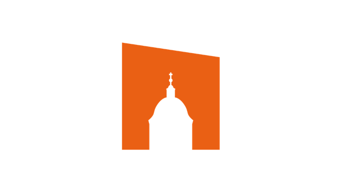 Silhouette eines kuppelgekrönten Gebäudes in leuchtendem Orange vor schwarzem Hintergrund.
