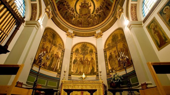 Church interior with ornate decorations and religious art.