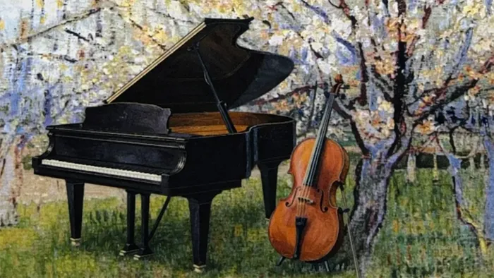 Et flygel og en cello ved et blomstrende træ