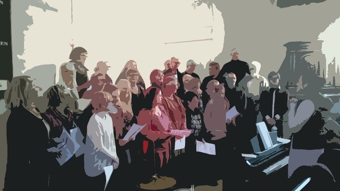 En gruppe af mennesker deltager i et møde i et kontor.