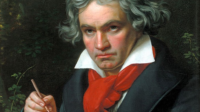 Porträt von Ludwig van Beethoven, vertieft in das Komponieren von Notenblättern mit nachdenklichem Ausdruck.