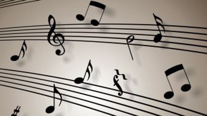 Musiknoter på noterblok