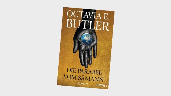 Deutschsprachiger Buchumschlag der deutschen Ausgabe von Octavia E. Butlers *„Parable of the Sower“* mit einer Hand, die einen Globus hält.