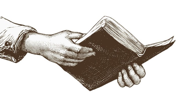 Eine Hand, die ein offenes Buch hält und den Akt des Lesens darstellt.