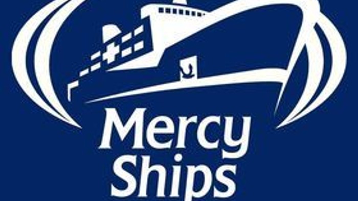 Mercy ships, the outline of a ship in white on a navy blue background.
