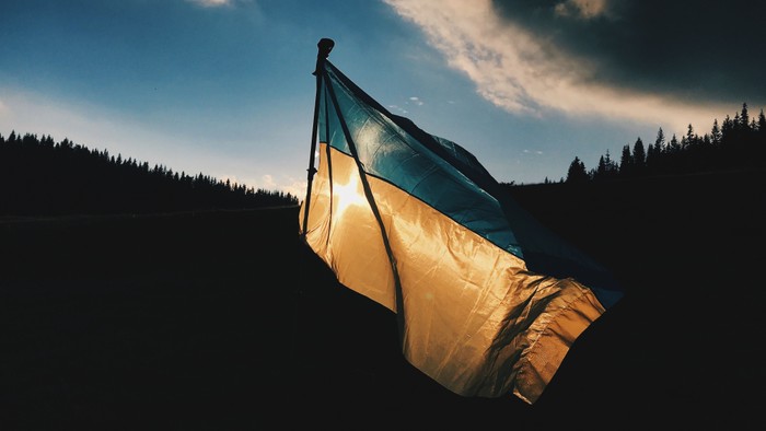 Flag waving against dark sky