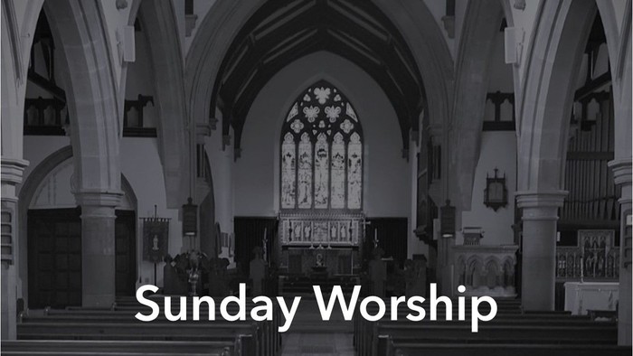 Church interior with pews, stained glass windows, and organ, labeled