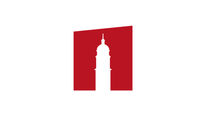 Eine markante Silhouette eines Uhrturms vor einem kräftigen roten Quadrat auf schwarzem Hintergrund.