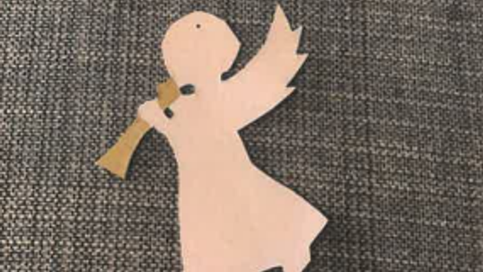 En papirklip i form af en dansende figur med udstrakt arme.