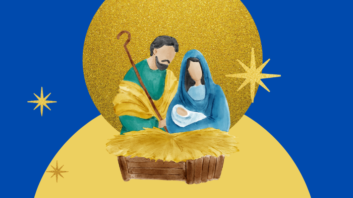 Maria und Josef stehen an der Krippe