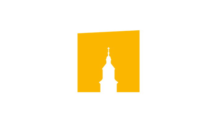 Silhouette einer Kirche mit Kuppel und Kreuz vor einem hellgelben Hintergrund.