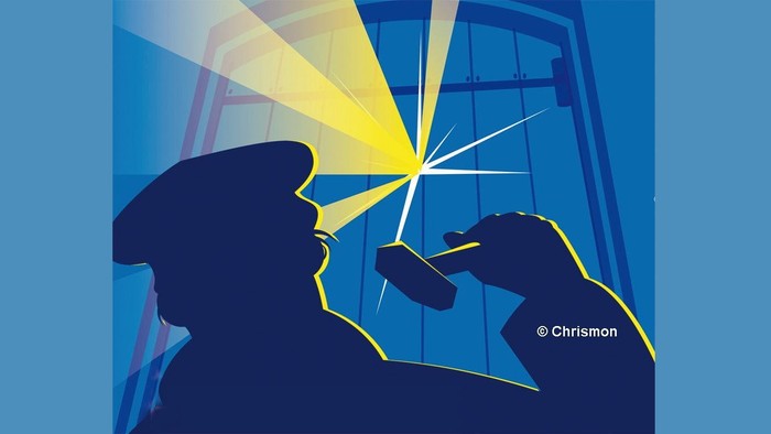 Die Silhouette einer Person mit einem Lichtstrahl, der eine Karte von Deutschland beleuchtet