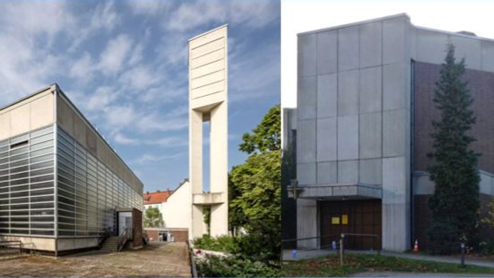 Moderne Industriegebäude mit einzigartigen architektonischen Designs und hohen vertikalen Elementen, umgeben von Grünflächen.