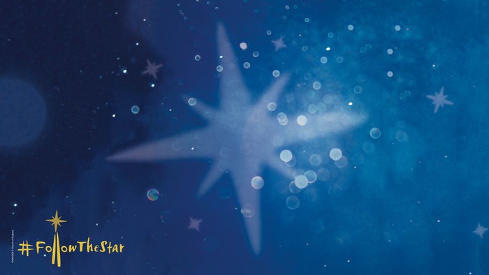 A glowing star with bokeh lights and stars, with the hashtag #FollowTheStar.