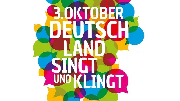 Plakat mit bunten Pubnkten für Deutschland singt und klingt