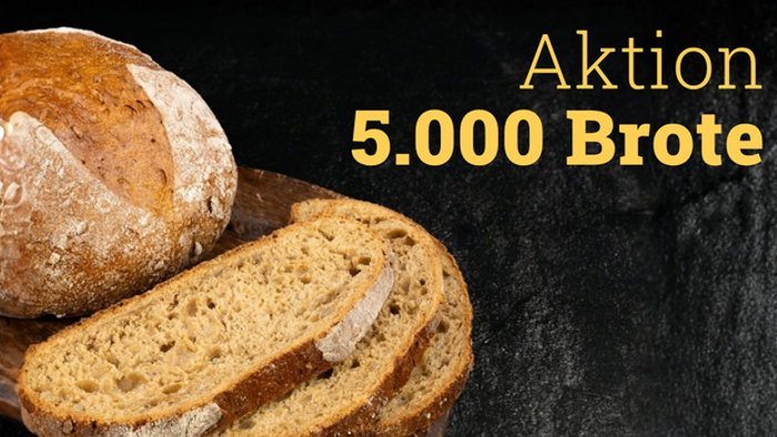 Werbekampagnenbild für eine Aktion mit 5.000 Laiben Brot, das geschnittenes Vollkornbrot zeigt.