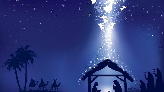 Silhouette of nativity scene with angels and starry sky