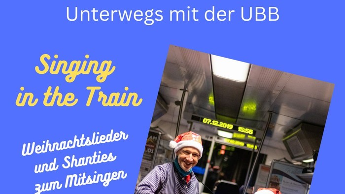 Plakat für eine Weihnachtsliedersingen-Veranstaltung im Zug