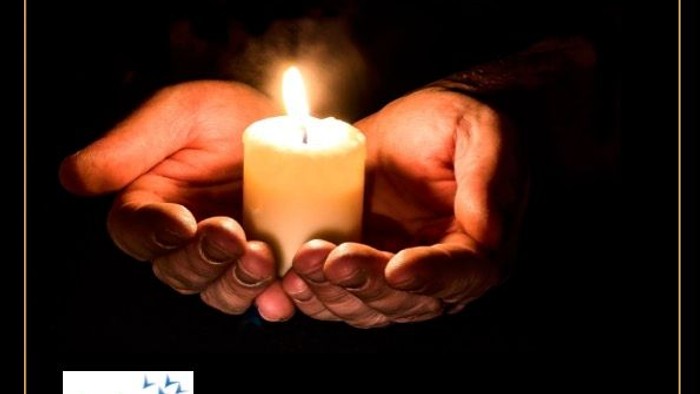 The image features a book cover titled 'The Mystery of God' with a candle held in hands, set against a dark background.