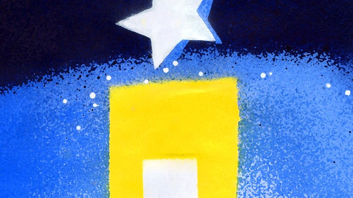 Ein gelbes Gebäude mit einem weißen Stern darüber vor einem blauen Nachthimmel