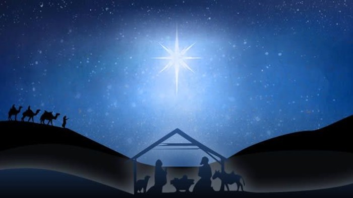 Silhouettes of figures and animals gather around a stable beneath a bright star in a night sky.