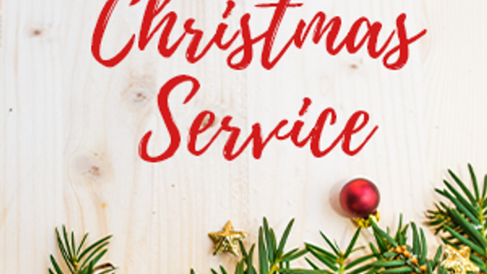 Christmas Service sign with pine branches and ornaments