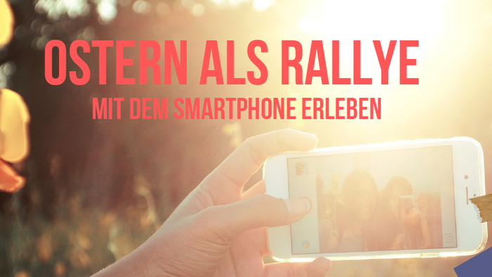 Hand hält Smartphone mit Bild von Menschenmenge, Text "OSTERN ALS RALLYE MIT DEM SMARTPHONE ERLEBEN"